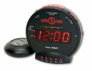 Black and red digital alarm clock showing 12:00 o'clock. Click to view its Amazon page.